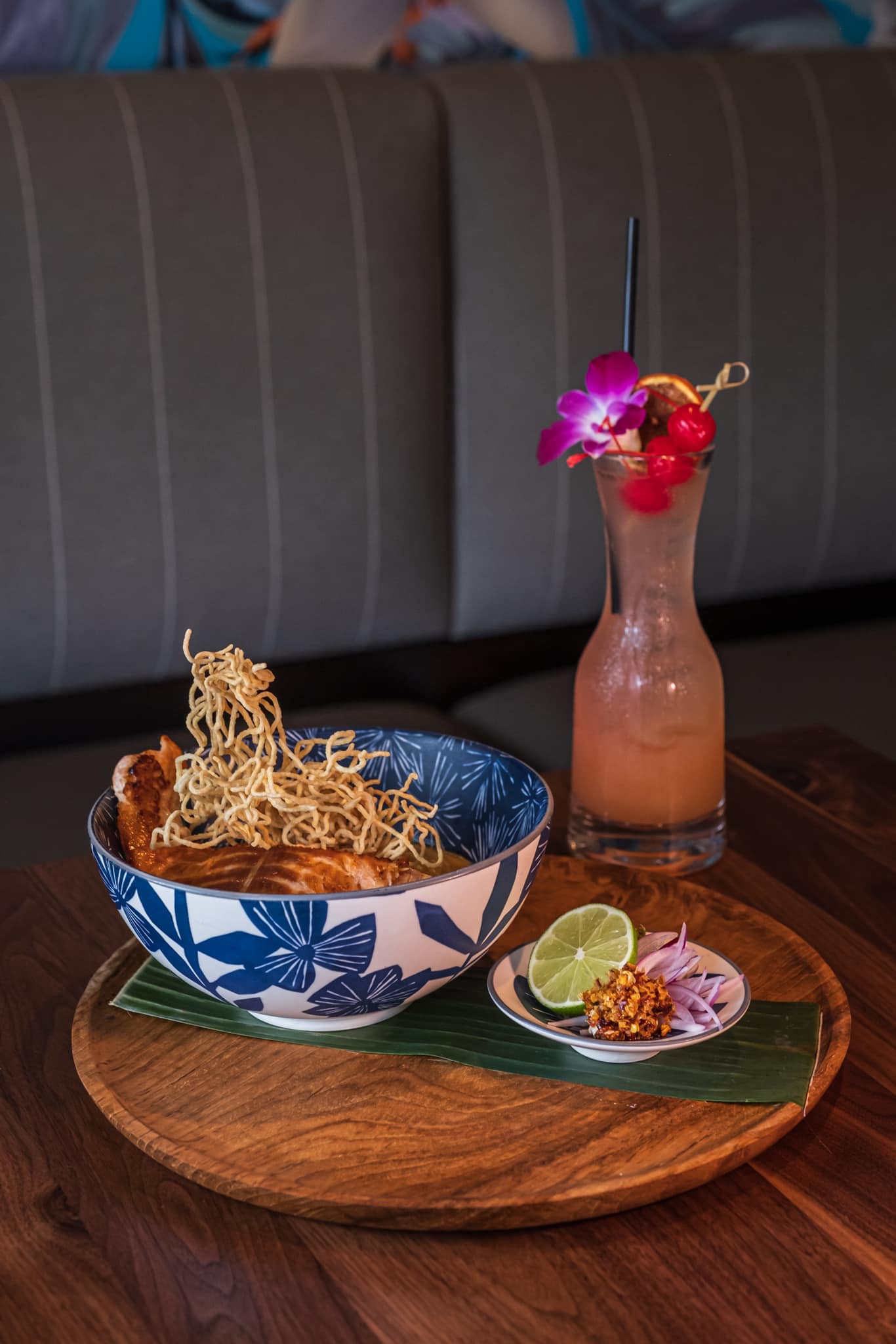 A plated bowl dish paired with a cocktail at Andalin